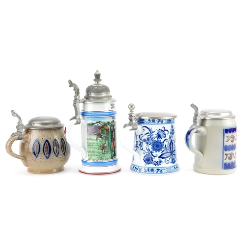 570 - Four German beer steins including two Goebel and a blue and white KPM example, each with pewter hing... 