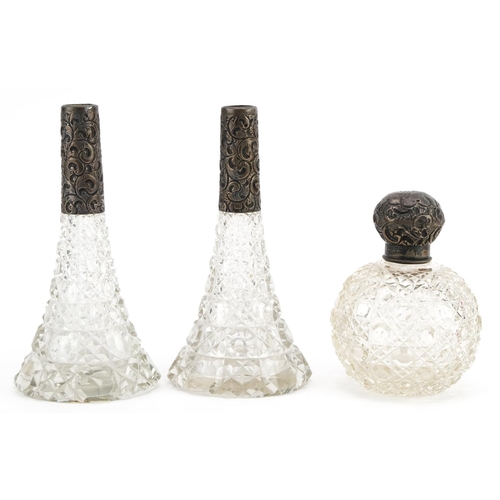 394 - Pair of Edwardian cut glass scent bottles with silver mounts and a globular cut glass scent bottle w... 