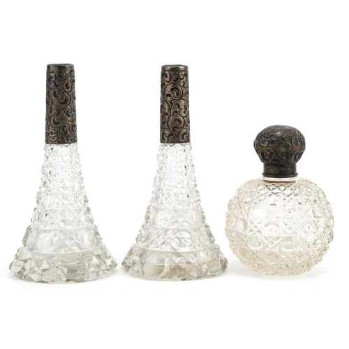 394 - Pair of Edwardian cut glass scent bottles with silver mounts and a globular cut glass scent bottle w... 