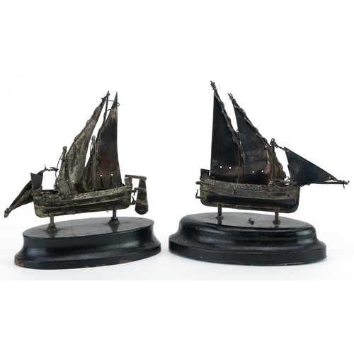 53 - Two Maltese miniature silver sailing boats raised on ebony bases, the largest 10cm high