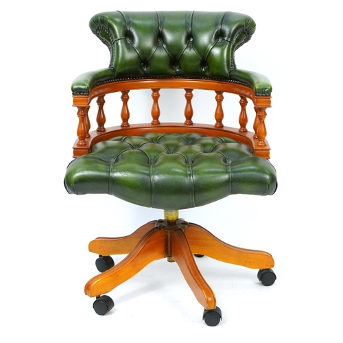 1030 - Yew framed captain's chair with green leather button upholstery, 87cm high