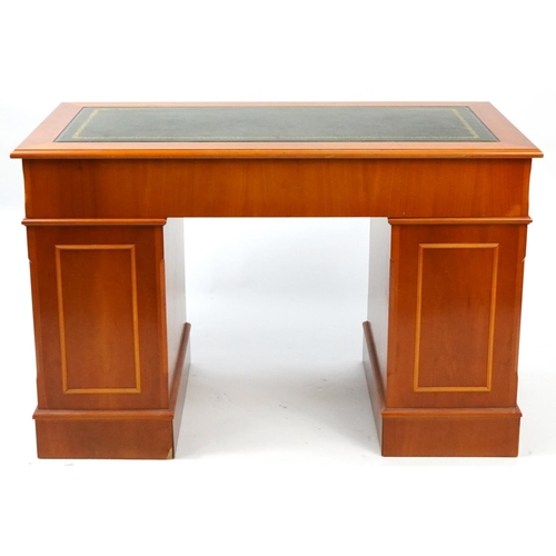 1015 - Yew twin pedestal desk with tooled green leather insert and eight drawers, 79cm high x 121cm W x 61c... 