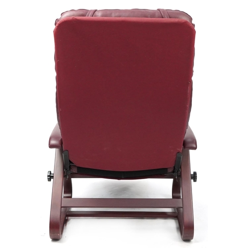 1068 - Mahogany framed burgundy leather reclining armchair, 117cm high