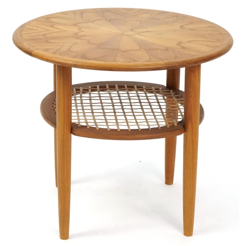 1054 - Lightwood occasional table with cane under tier, 48.5cm high x 55cm in diameter