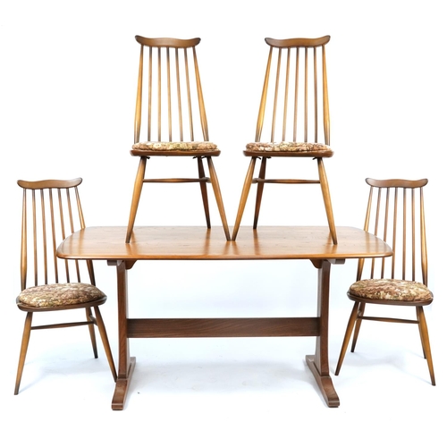 1096 - Ercol elm and beech Plank dining table and a set of four Goldsmith dining chairs, the table 72cm H x... 