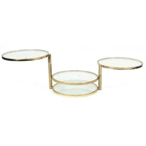 1014 - Contemporary gilt metal and glass four tier revolving occasional table, 41.5cm high x 53.5cm in diam... 