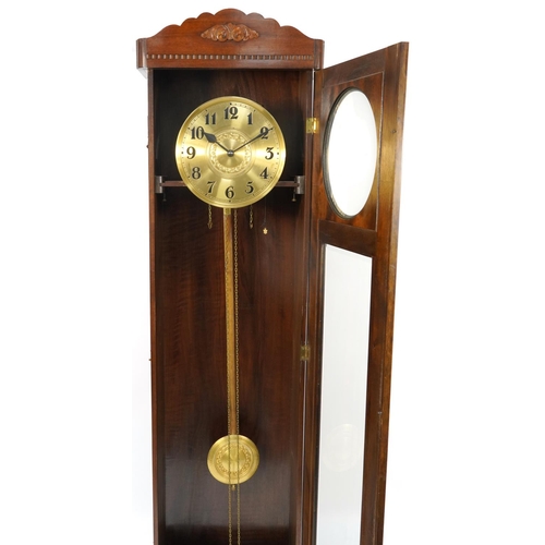 1061 - Mahogany longcase clock with visible pendulum and weights, the gilt dial with Arabic numerals, 203cm... 