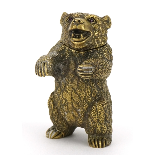 1268 - Novelty brass vesta case in the form of a bear with inset ruby eyes, impressed marks to the base, 6.... 