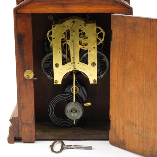 533 - Ansonia Clock Co oak cased mantle clock striking on a gong, 41cm high