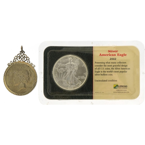 2452 - United States of America 2002 silver eagle and a 1922 dollar housed in a silver pendant mount