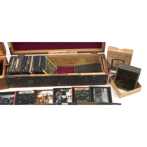 2474 - Collection of 19th century glass slides arranged in two pine cases, predominantly black and white an... 