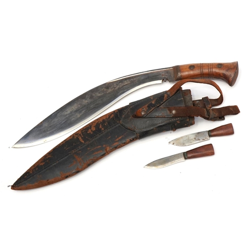 2199 - Military interest Gurkha's Kukri knife with hardwood handle, steel blade and leather sheath, impress... 