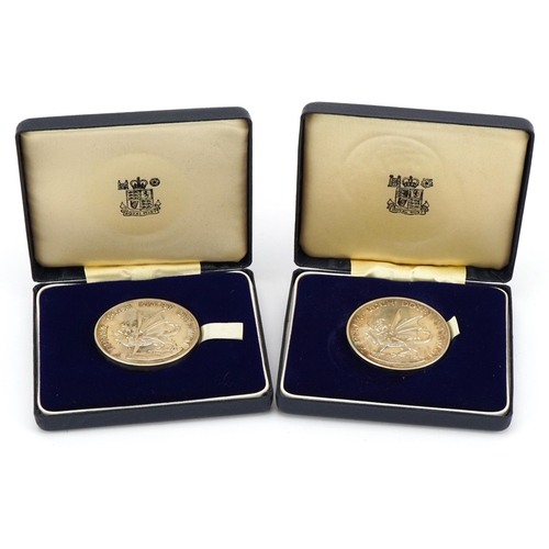 2420 - Two 1969 Prince of Wales silver Investiture medals housed in fitted cases, total 140g