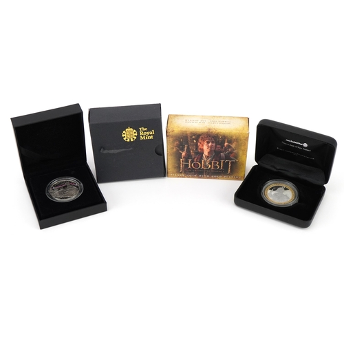 2437 - Two silver proof coins with cases and boxes including ten Z silver proof coin commemorating The Hobb... 