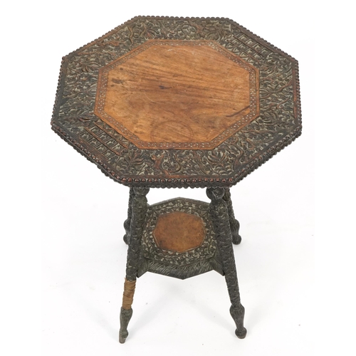 1040 - Anglo Indian hardwood occasional table with under tier profusely carved with wild animals and flower... 