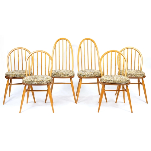 1003 - Ercol light elm plank dining table with set of six Windsor dining chairs having floral upholstered c... 