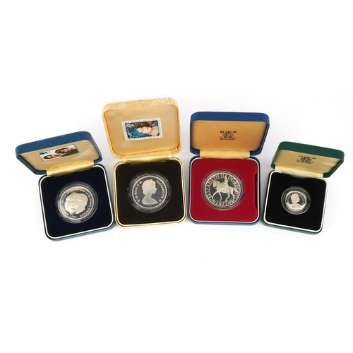 2407 - Four silver proof coins with cases including 1977 crown and 1983 one pound