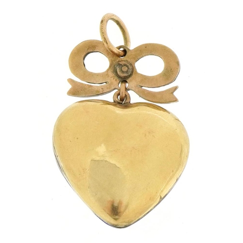 3002 - Unmarked gold and enamel bow love heart pendant set with rubies and pearls, 3.8cm high, 8.3g