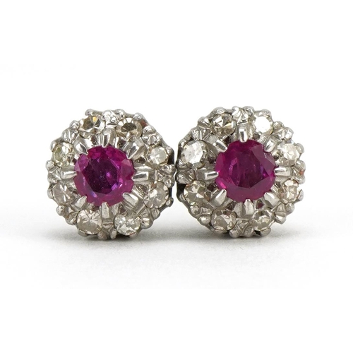 3008 - Pair of unmarked white gold ruby and diamond two tier cluster stud earrings, each ruby approximately... 