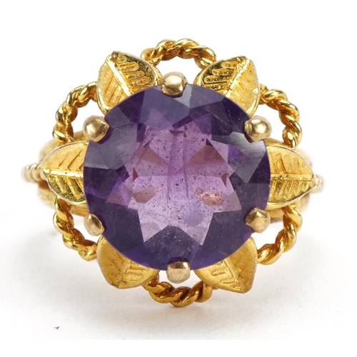 3010 - 9ct gold amethyst solitaire ring in the form of a flower, the amethyst approximately 12.0mm in diame... 