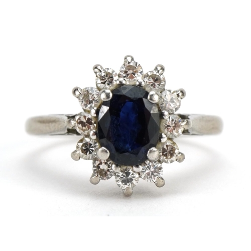 3012 - 18ct white gold and platinum sapphire and diamond cluster ring, the sapphire approximately 6.8mm x 5... 