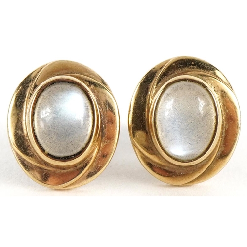 3026 - Pair of 9ct gold cabochon moonstone stud earrings, the moonstones approximately 7.9mm x 5.9mm, 1.3cm... 