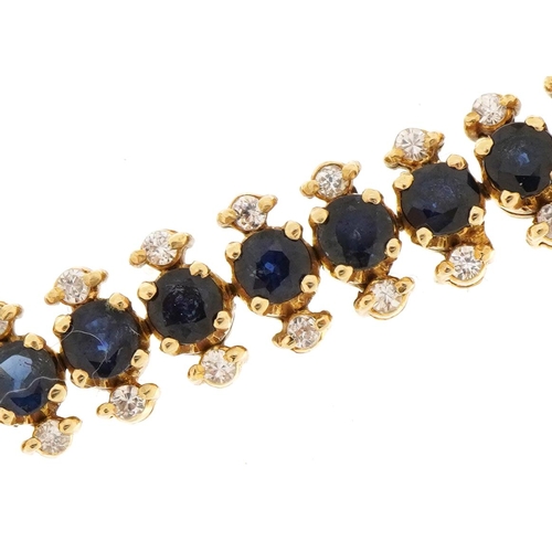 3038 - 9ct gold sapphire and clear stone three row bracelet with safety chain, 11.2g