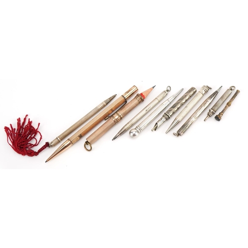 434 - Ten Victorian and later silver, white metal and yellow metal propelling pencils including one with i... 