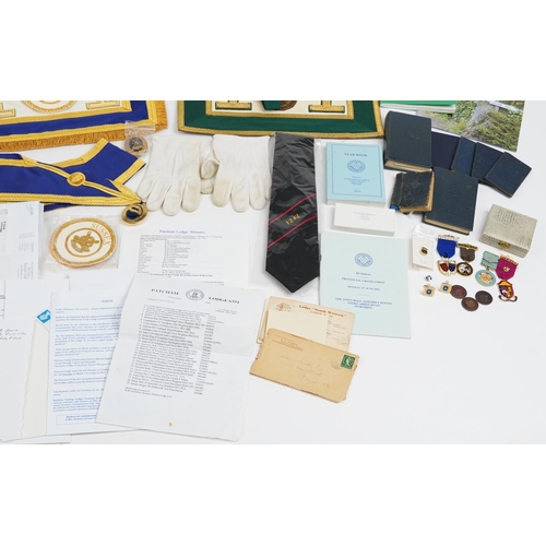 329 - Masonic regalia including sashes, enamelled jewels and coins