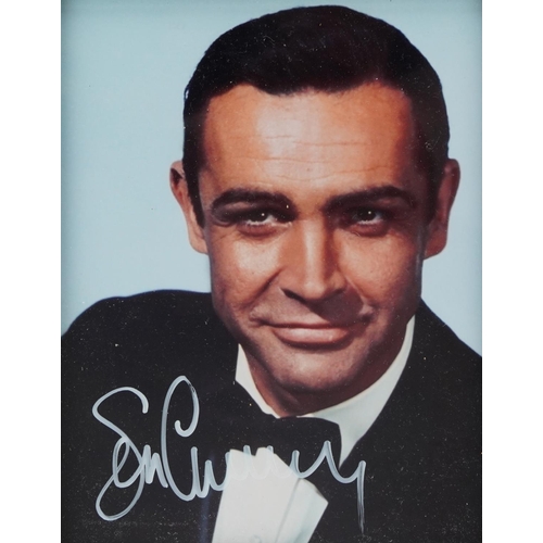 2485 - James Bond interest photograph of Sean Connery, signed in ink, framed and glazed, overall 32cm x 27c... 