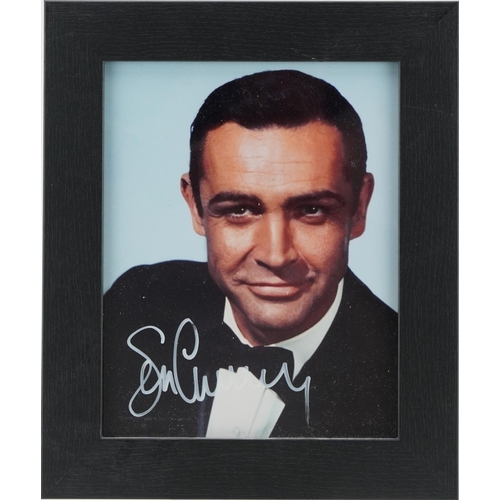 2485 - James Bond interest photograph of Sean Connery, signed in ink, framed and glazed, overall 32cm x 27c... 