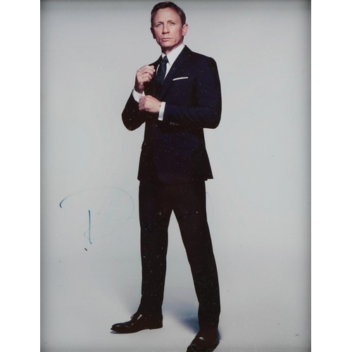 2481 - Two James Bond interest Daniel Craig photographs including Spectre and one signed in ink by the acto... 