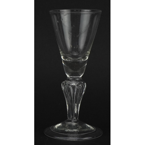 67 - Eighteenth century glass with hollow stem on folded foot, 14cm high