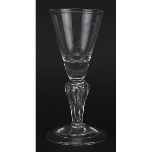 67 - Eighteenth century glass with hollow stem on folded foot, 14cm high