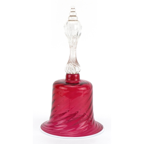 205 - Victorian glass table bell with writhen cranberry glass bowl and white overlaid rim, 28cm high