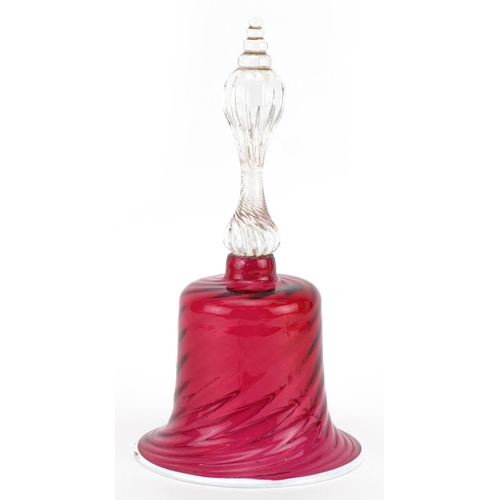 205 - Victorian glass table bell with writhen cranberry glass bowl and white overlaid rim, 28cm high