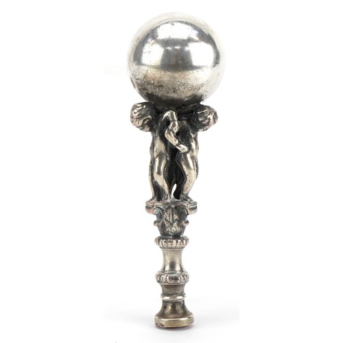 468 - Victorian silver plated desk seal in the form of three cherubs holding a ball aloft, 12cm high