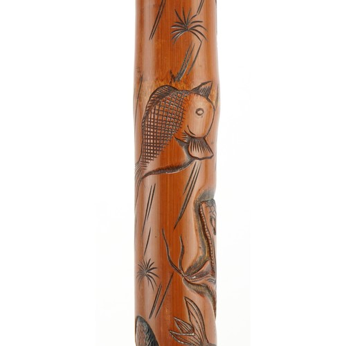 346 - Good Japanese bamboo walking stick finely carved with mythical animals and fish, signed with charact... 