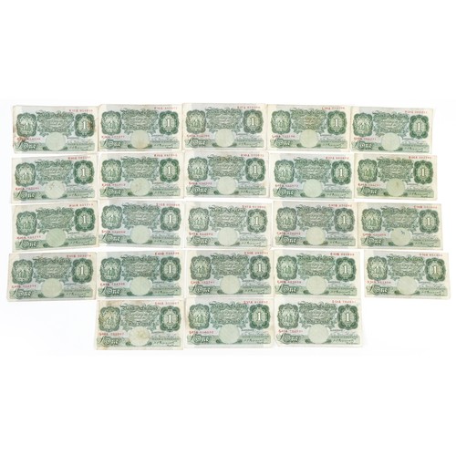 2490 - Twenty three Bank of England one pound notes, each Chief Cashier K O Peppiatt, various serial number... 