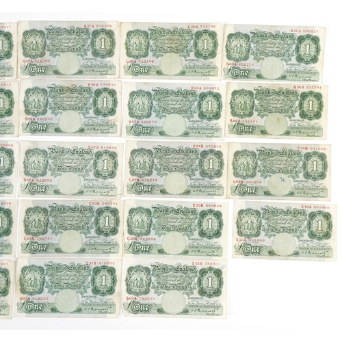 2490 - Twenty three Bank of England one pound notes, each Chief Cashier K O Peppiatt, various serial number... 