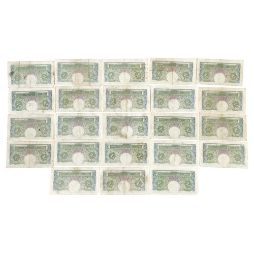 2490 - Twenty three Bank of England one pound notes, each Chief Cashier K O Peppiatt, various serial number... 