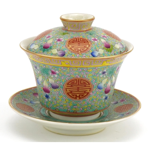 1350 - Chinese blue ground porcelain tea bowl and cover on stand hand painted in the famille rose palette w... 