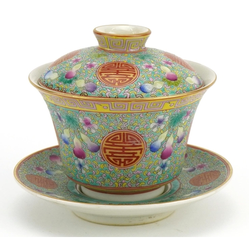 1350 - Chinese blue ground porcelain tea bowl and cover on stand hand painted in the famille rose palette w... 