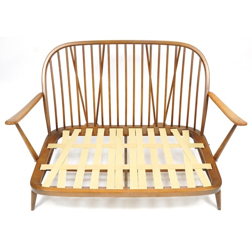 1106 - Ercol Windsor elm and beech two seater settee with floral lift off cushions, 135cm Wide