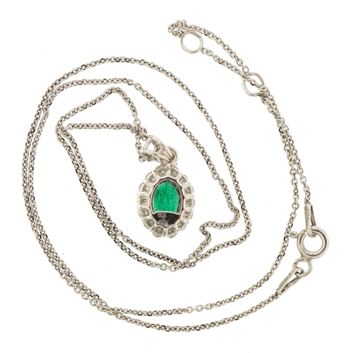 3040 - 18ct white gold emerald and diamond cluster pendant on silver Belcher link necklace, total emerald w... 
