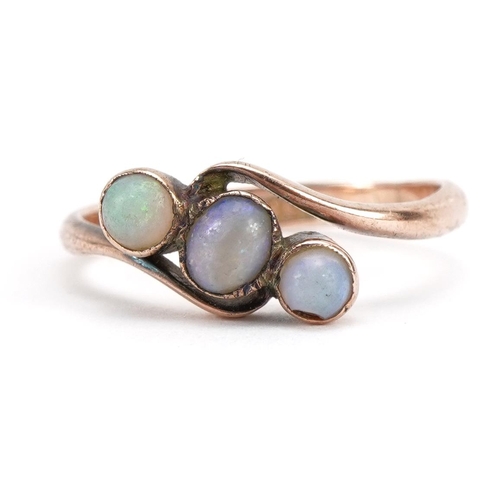 3051 - 9ct rose gold cabochon opal three stone crossover ring, size M, 1.8g