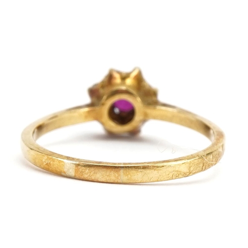 3054 - 18ct gold ruby and diamond flower head ring, size O/P, 2.7g