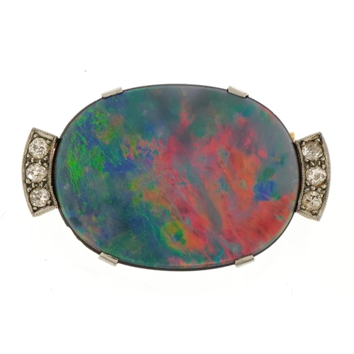 3009 - 18ct gold mounted opal brooch set with six diamonds, the opal approximately 23.6mm x 18.4mm, 3.0cm w... 