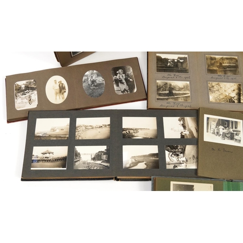 1324 - Good collection of early 20th century social history black and white photographs arranged in nine al... 