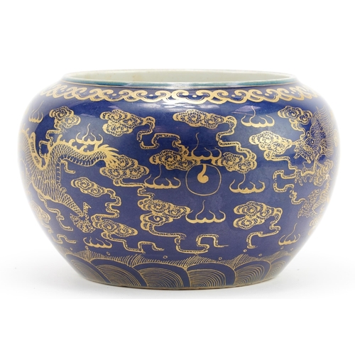 145 - Chinese porcelain powder blue ground jardiniere gilded with dragons chasing the flaming pearl amongs... 